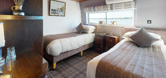 Throws on beds aboard the Shannon Princess Barge
