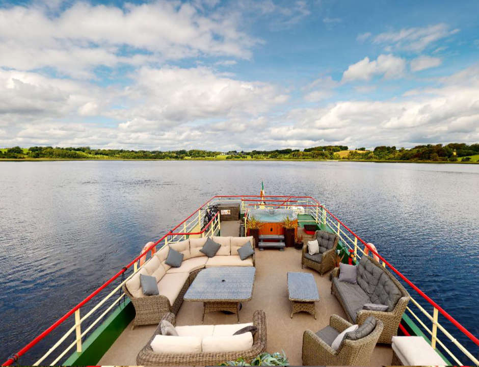 Shannon Princess deck with facilities for passengers and the river landscape in the background